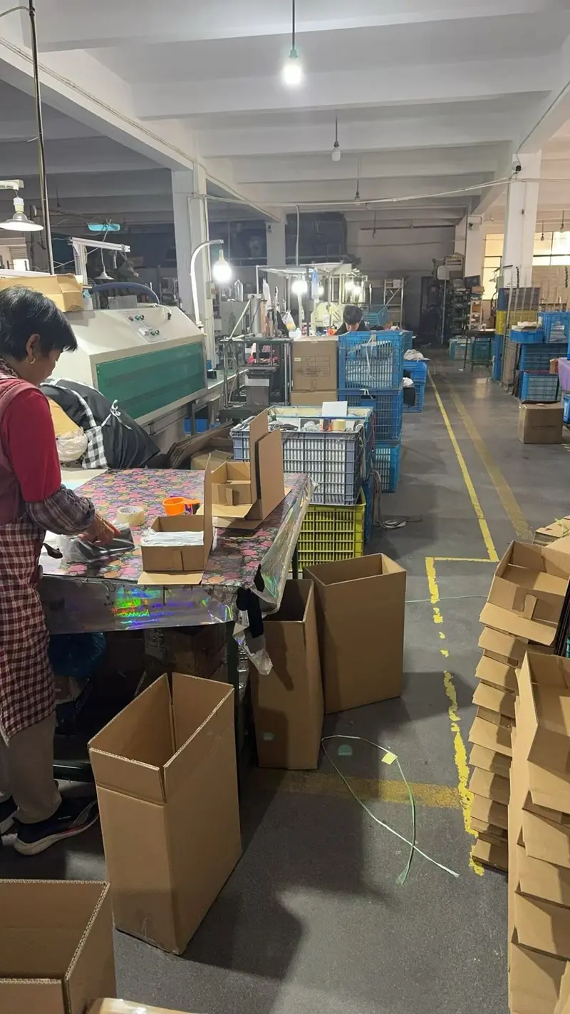 XH Glasses Case factory workshop — real production line with workers